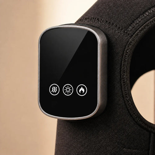 Close view of the powered-off controller on the black ThermoLuma Shoulder Wrap.